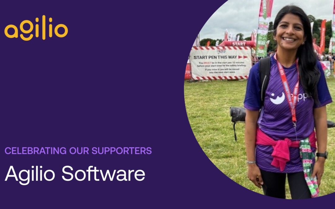 A smiling fundraiser in a purple Ripple t-shirt stands at a race start area, celebrating their support for Ripple Suicide Prevention